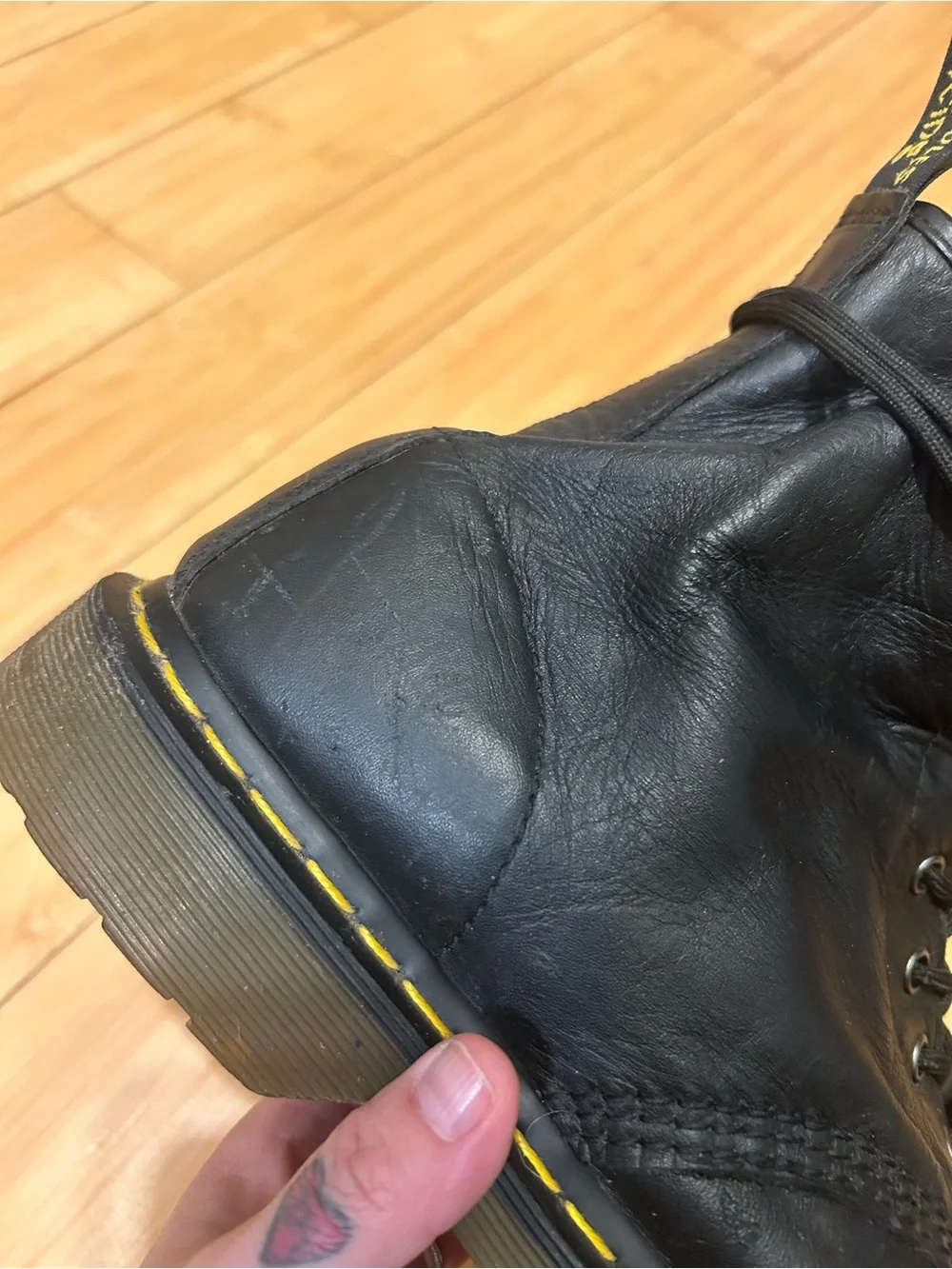 Dr. Martens Black Leather 8-Eye Lace-Up Boots with Yellow Stitching